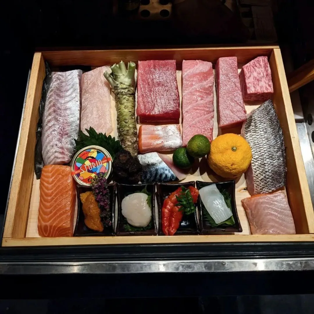 Overhead view of the day's selection of fish, caviar and citrus.